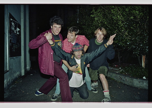 Nardwuar outside the Capitol Theatre, Olympia , Washington, USA  at Yo-Yo-A-Go-Go 1997 with Jared (Karp), Chad Q (Black Booking) and Scott (Evaporators, Thee Goblins) . (Pic: Scott Livingstone)