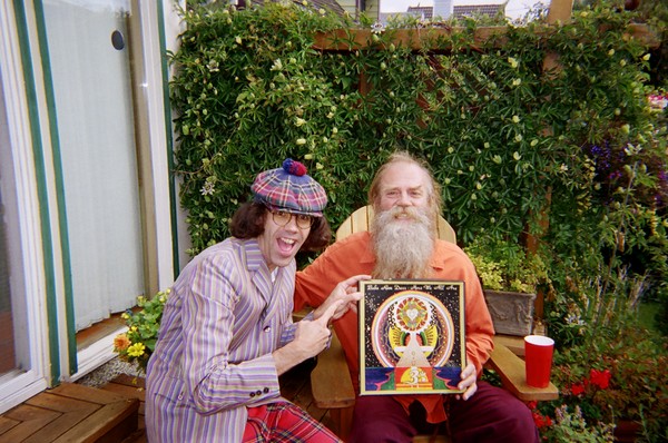 Bhagavan Das and  Nardwuar holding Baba Ram Dass' ( Richard Alpert ) "Be Here Now" Record, which was recorded in Vancouver BC!