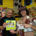 Daniel Johnston, Nardwuar (holding Cub's "Betti-Cola" 7incher -- Cub covered  Daniel's "Tell Me Now" on "Betti-Cola") The Comic Shop, Vancouver, BC, Canada!