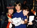 Nardwuar, Chris Murphy of Sloan, Leora. Sonar, Vancouver, BC, Canada. Leora is showing Chris Sloan's inclusion on the playlist of United Airlines "Rock United" inflight entertainment channel in United Airlines '  "Hemispheres" inflight magazine.  Apparently it's the first time Sloan has appeared as inflight entertainment on a non- Canadian carrier!   
