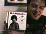 Jello holding B.J. CD